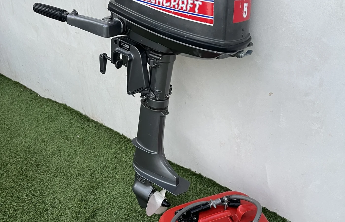 Sold Seacraft 5 HP outboard with fuel tank and spare propeller