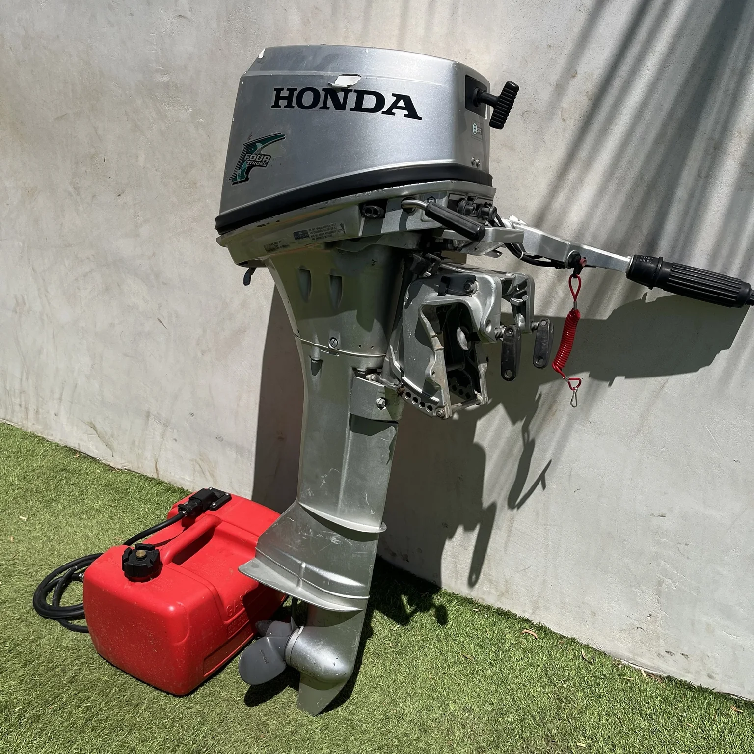 Honda 8 HP outboard opposite side with tank